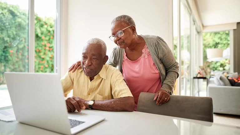 senior couple at laptop gettyimages .jpg