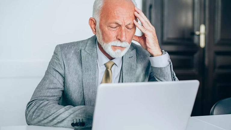 senior man suit laptop stress gettyimages .jpg