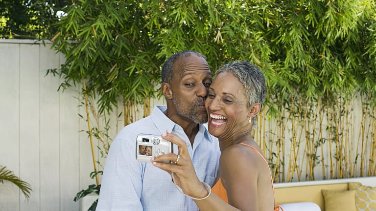smiling couple taking selfie.jpg