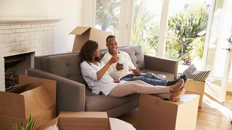 smiling couple toasting with coffee mugs on c.width oXOEFhv.jpg