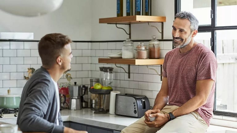 two people talking in kitchen STtBzNx.width .jpg