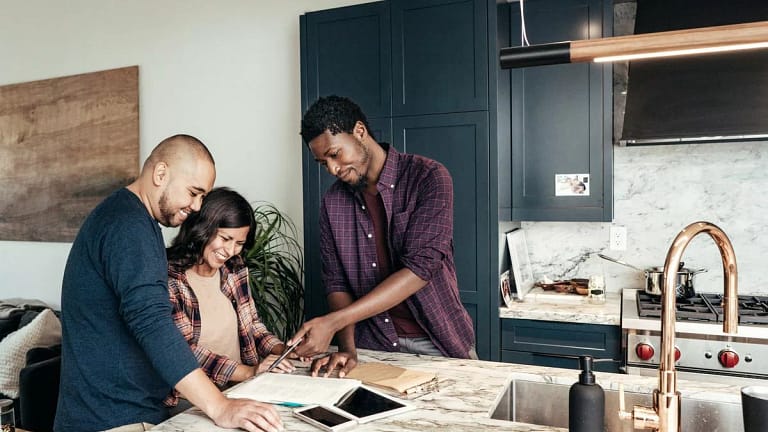 two people with contractor in kitchen OiPYQ.width .jpg