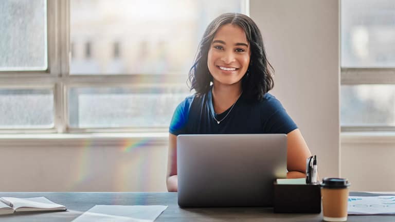woman s smiling laptop gettyimages .jpg