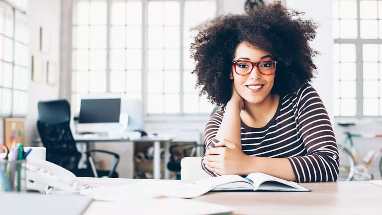 woman s smiling table gettyimages .jpg