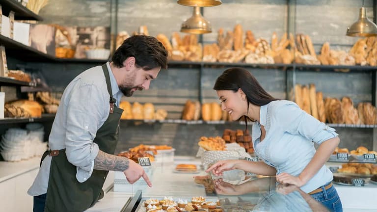 woman buying pastry at bakery.width .jpg