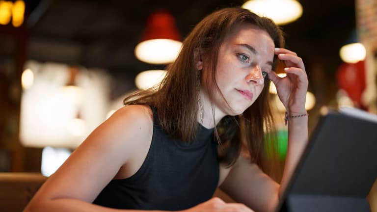 young woman working on digital tablet.jpg