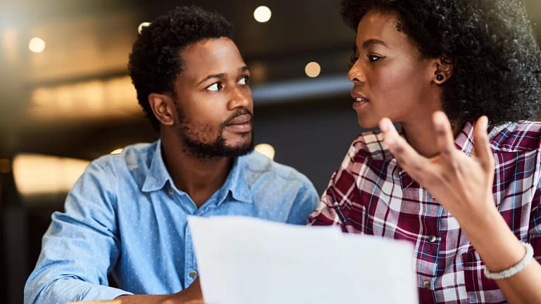 Couple dismayed by document in hands zNKqbht.width .jpg
