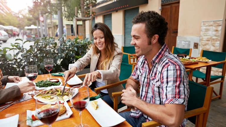 Couple sharing food at a european style resta.width VdwCA.jpg