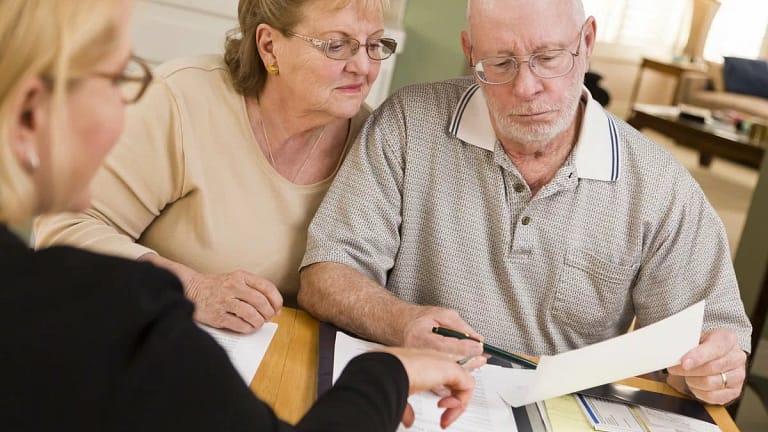 Older couple looking at paperwork DyGr.width .jpg