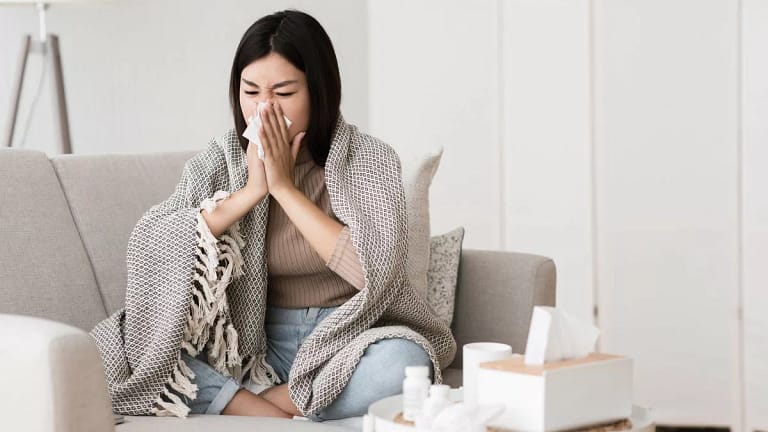 Sick woman blowing nose qBgNC.width .jpg