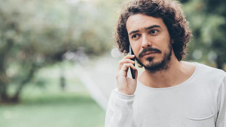 man s s outside phone gettyimages .jpg