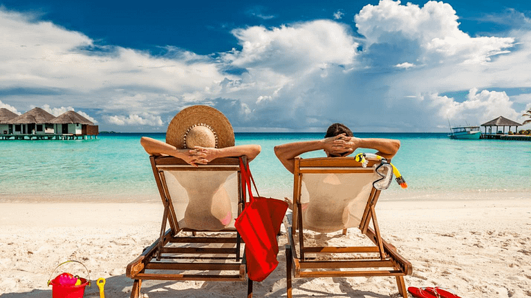 man and woman in beach chairs.width tZcHGNG.png