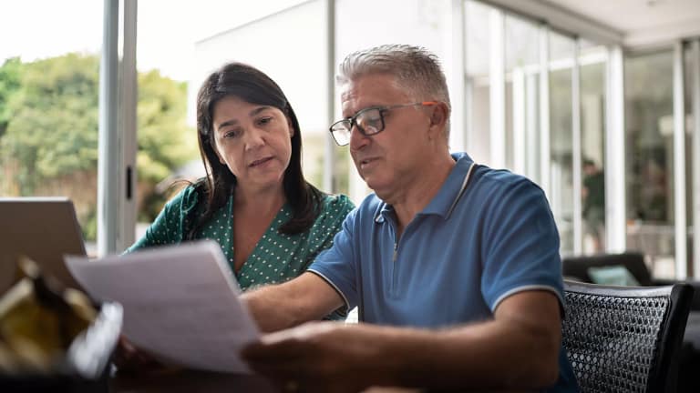 middle aged couple looking at document.jpg