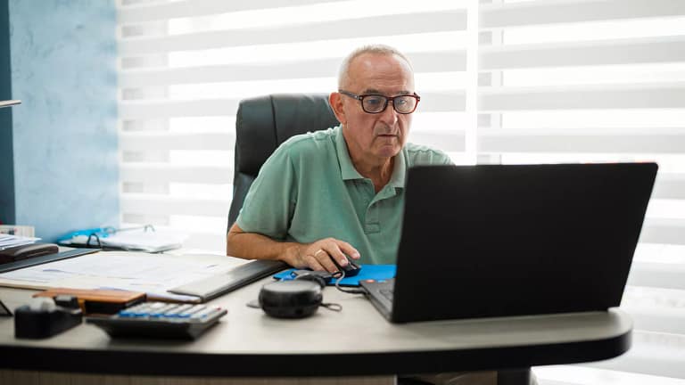 older man desk serious gettyimages .jpg