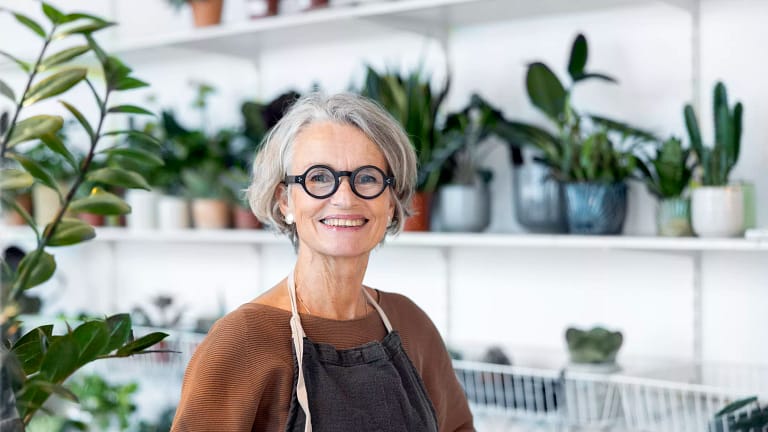 person smiling in a flower shop.jpg