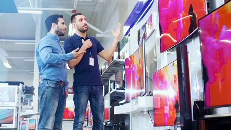 man with salesman at tv store.width .jpg
