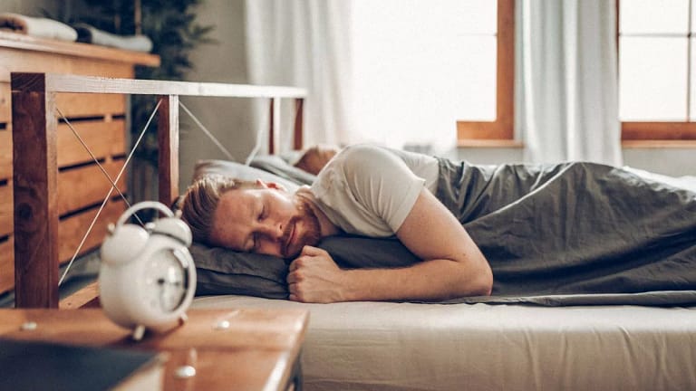 man sleeping in bed oRytPC.width .jpg