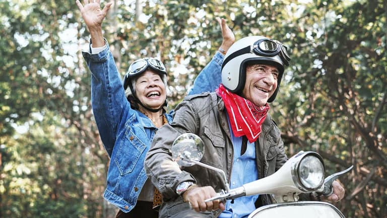 Retirees on a moped TMpuav.width .jpg
