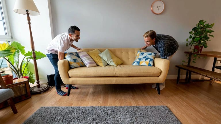 two people moving couch ctnOac.width .jpg