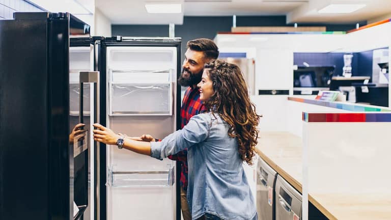 Young couple shopping for fridge.width .jpg