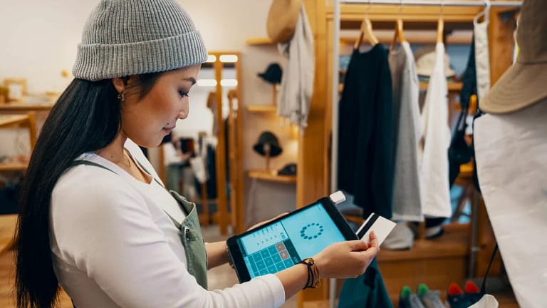 store clerk swiping credit card.width .jpg