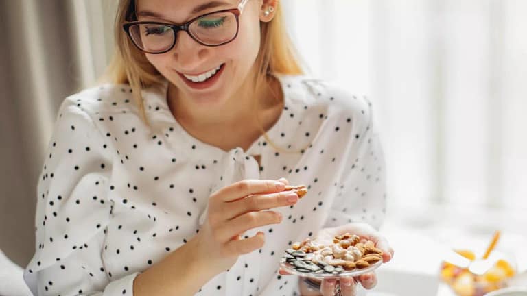 Person munching on some snacks they hold in t.width .jpg