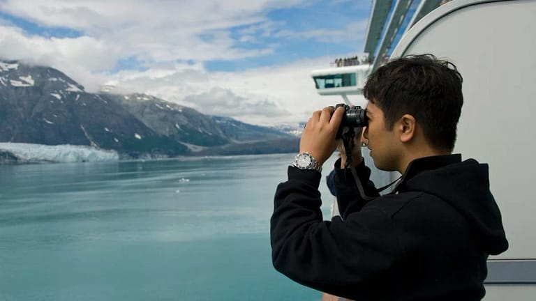 Person using binoculars on cruise ship GdSIfW.width .jpg