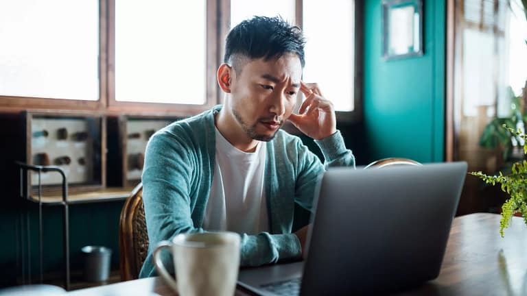 concerned unhappy person staring at laptop.jpg