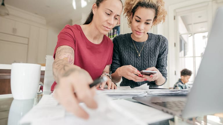 couple looking at documents and smartphone.jpg