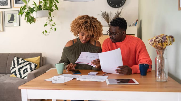 couple reviewing papers budgeting.jpg
