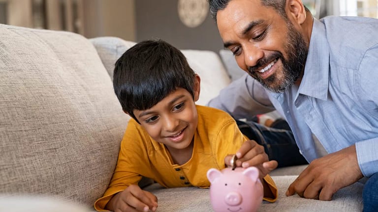 family child saving piggy bank financial lessons save money x bdf.jpg