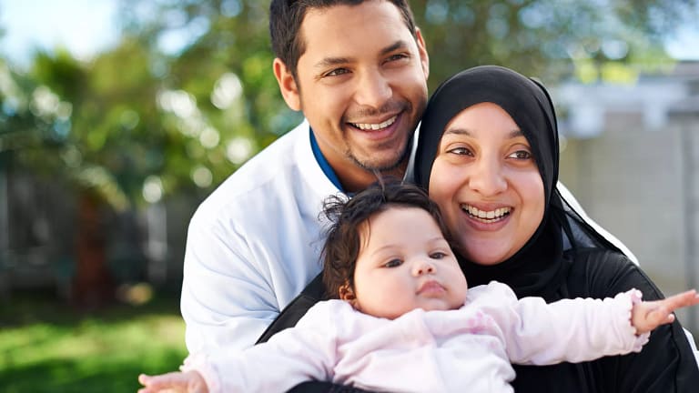 getty smiling happy family with child.jpg