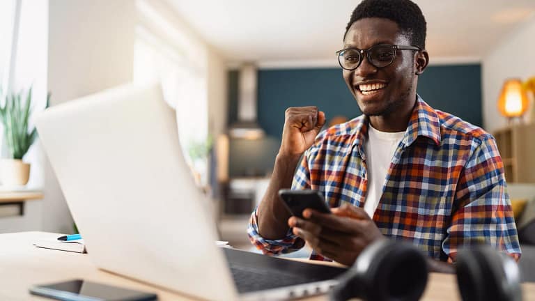 man s laptop smiling gettyimages .jpg