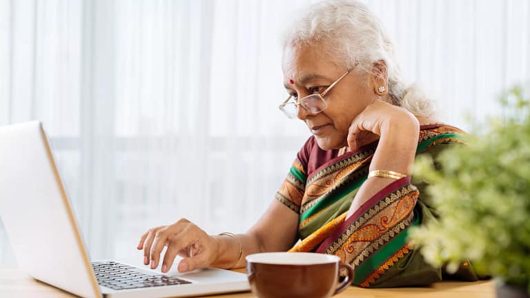 serious senior staring at laptop.jpg