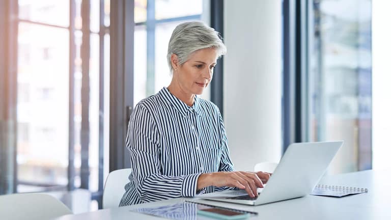 woman older laptop gettyimages .jpg