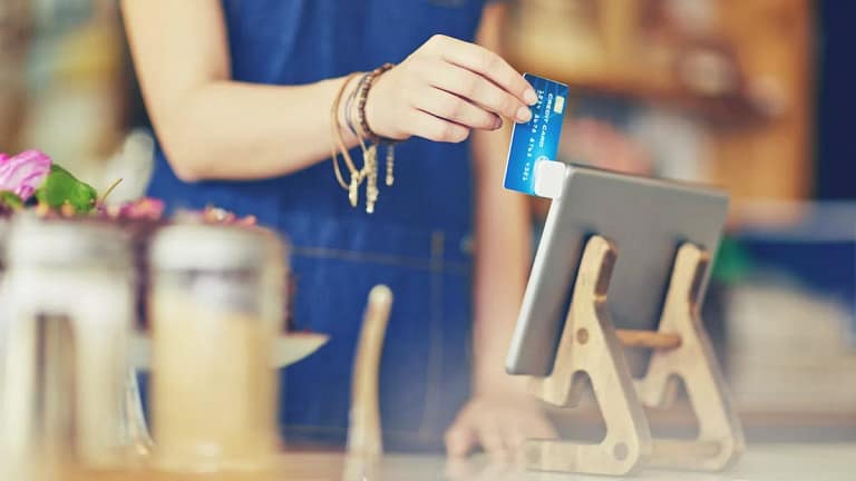 cashier swiping credit card YhXzHx.width .jpg