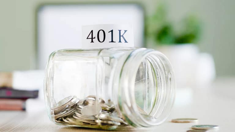 getty images k savings jar tipped over half empty.jpg