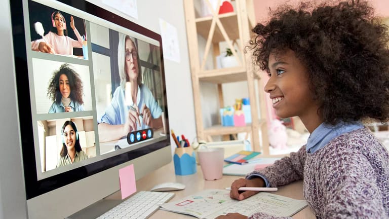 gettyimages child interacting with others on computer.jpg