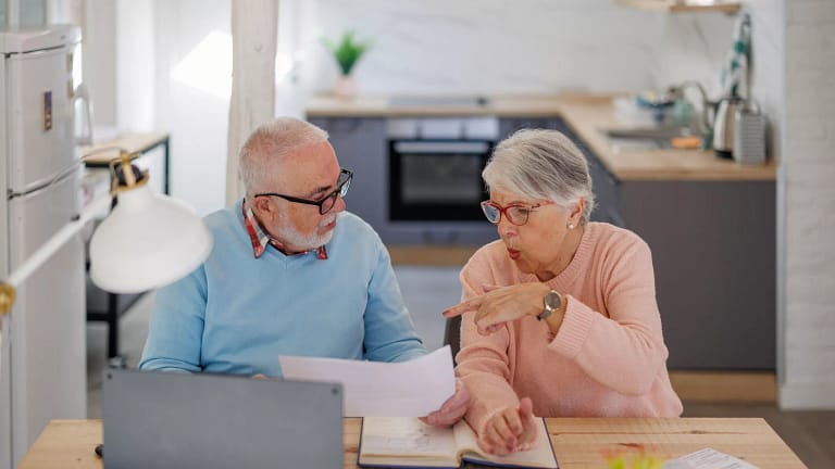 senior couple at a desk serious gettyimages .jpg