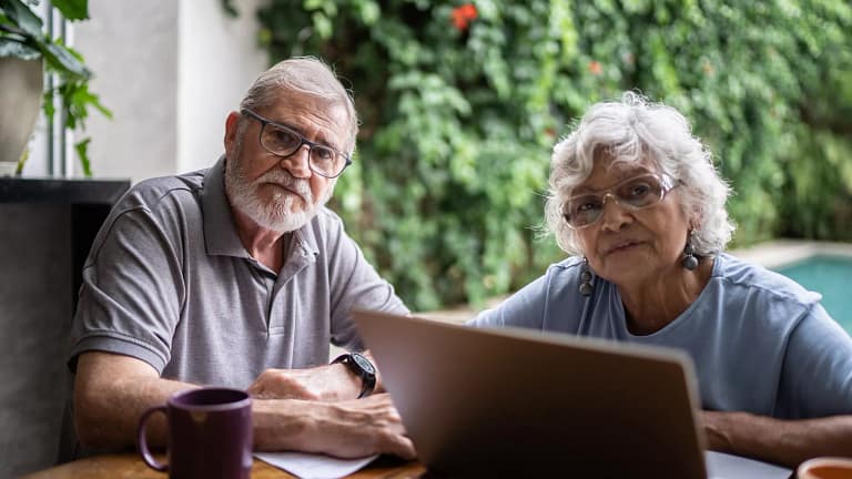 senior couple laptop serious gettyimages .jpg