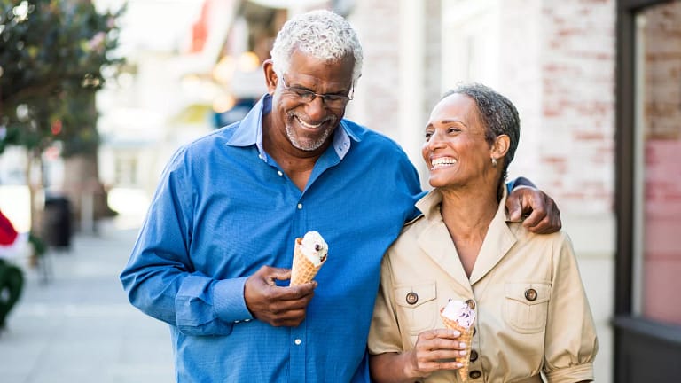 smiling couple eating ice cream cones.jpg