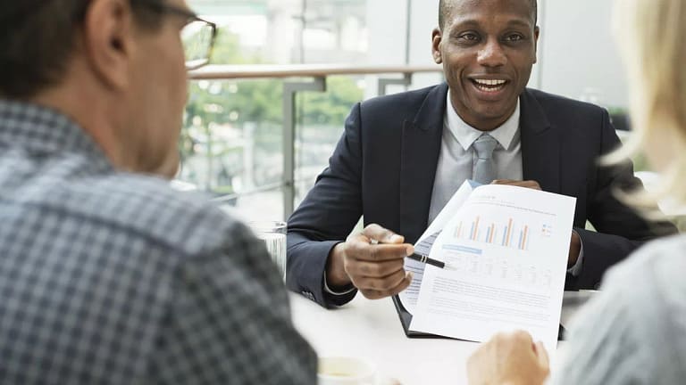 mature couple talking to financial advisor PO.width CEYgc.jpg