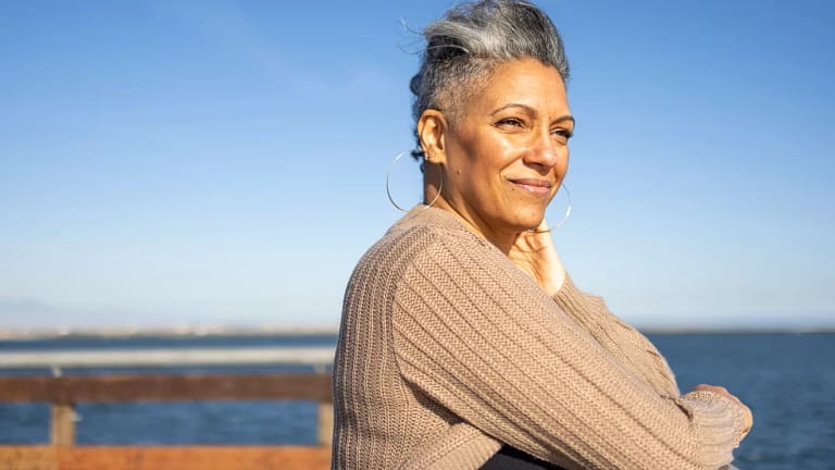smiling person looking out over the ocean.jpg